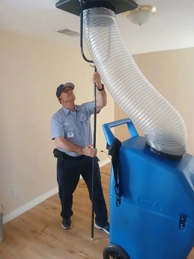 HVAC Installation technician using HEPA equipment in Crandall